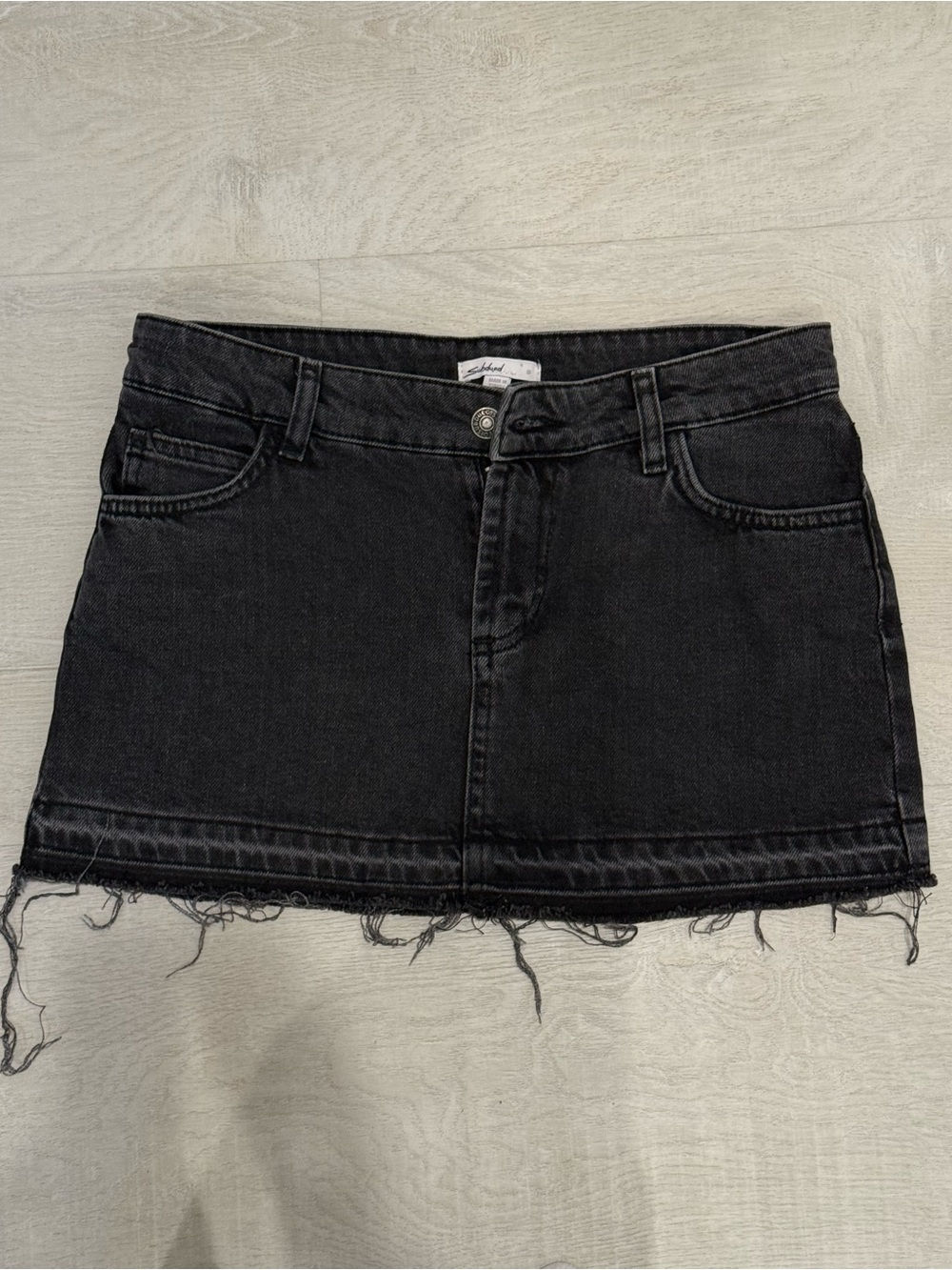 Subdued Black Denim Mini Skirt with Raw Hem